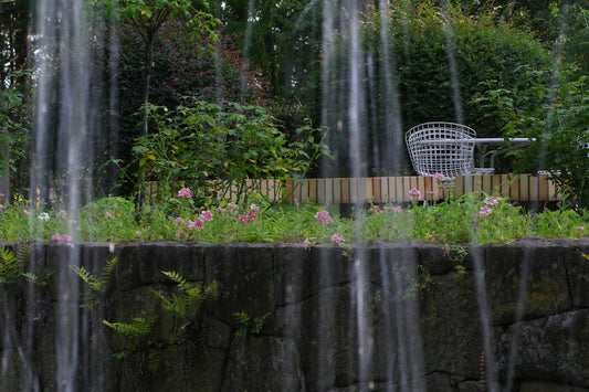 A garden with a waterfall in the middle of it