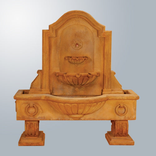 Anduze Wall Fountain Short in a garden setting