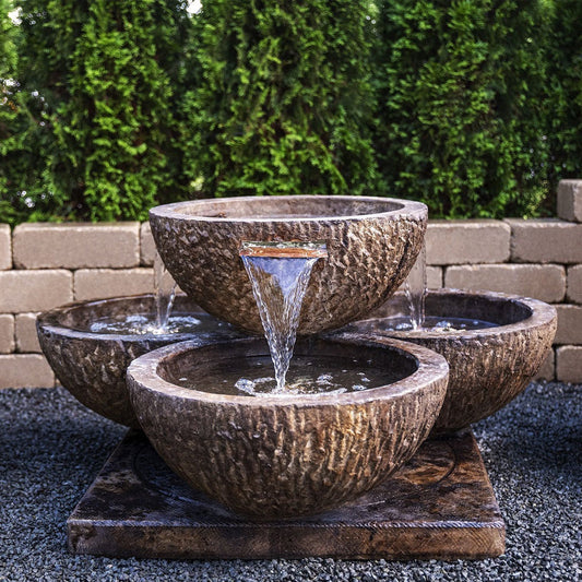 Coco Quad Fountain outdoor water feature with four tiers and natural stone finish