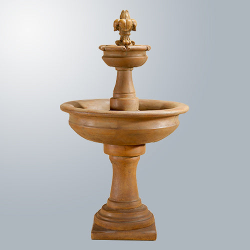 Fleur De Lis Two Tier Fountain in a garden setting