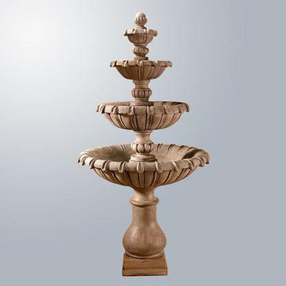 Grand Chateau Four Tier Fountain in a garden setting