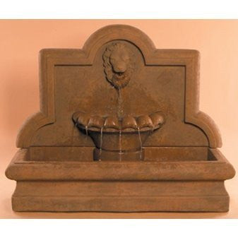Large cast stone outdoor wall fountain with a lion head design