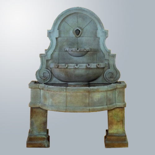 Liguria Wall Fountain With Legs in a garden setting