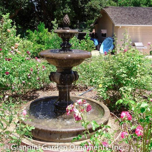 Quattro Lion Two Tier Pond Fountain in a garden setting
