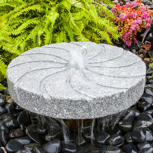 Swirl Millstone Granite Stone Fountain with water flowing