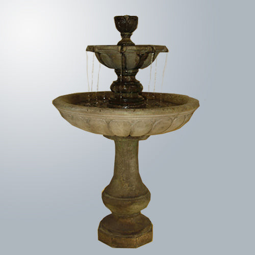 Vicentina Two Tier Fountain in a garden setting