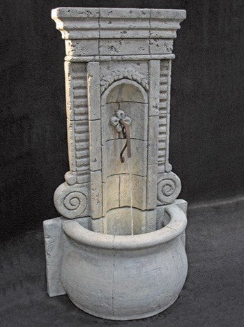 Tall outdoor fountain with champagne wall design