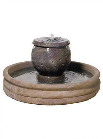 Small cast stone garden fountain for a mall planter